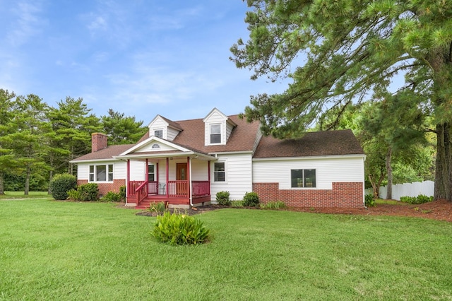 cape cod home with a porch and a front yard