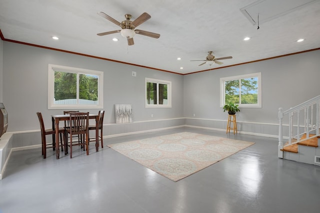 interior space featuring ceiling fan and ornamental molding