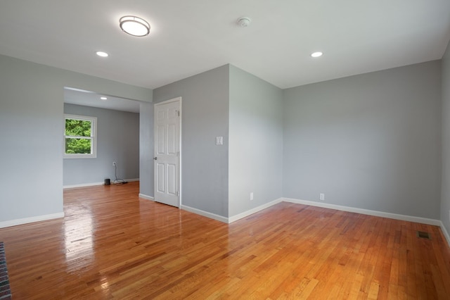 unfurnished room featuring light hardwood / wood-style flooring