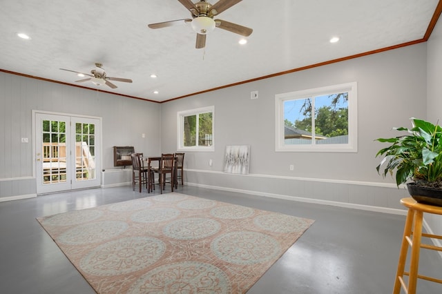 interior space with a textured ceiling, ceiling fan, crown molding, and french doors