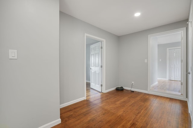 unfurnished room featuring hardwood / wood-style flooring