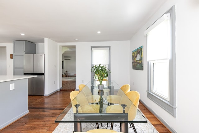 dining space featuring dark hardwood / wood-style floors