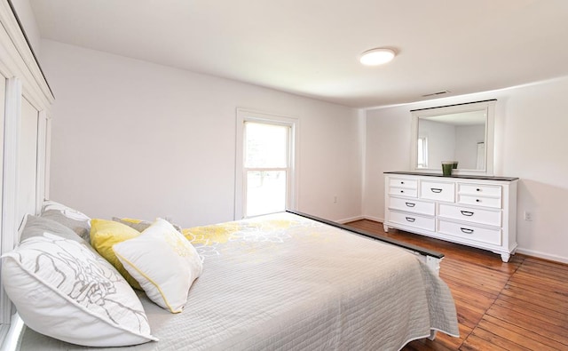 bedroom with wood-type flooring