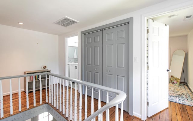 hallway featuring wood-type flooring