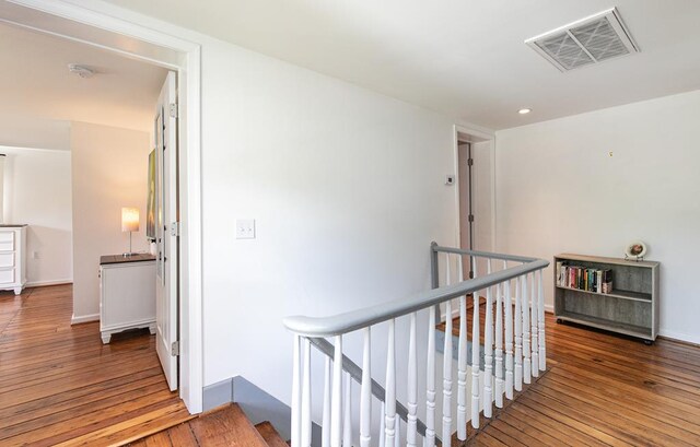 corridor with light hardwood / wood-style floors