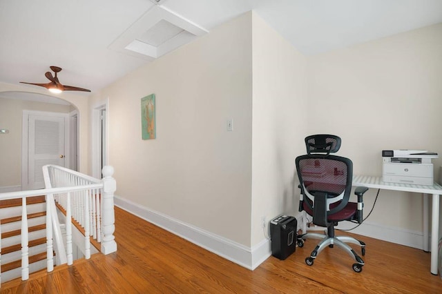 office area featuring baseboards and wood finished floors