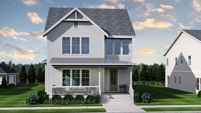 view of front facade with a front lawn and covered porch