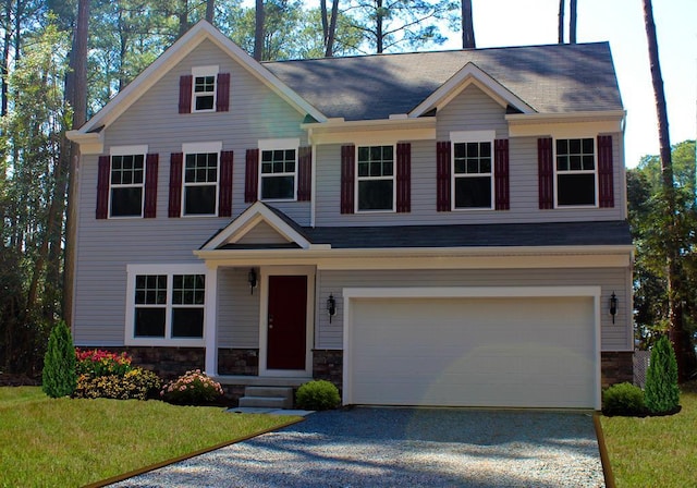 craftsman inspired home featuring a garage, stone siding, a front lawn, and gravel driveway