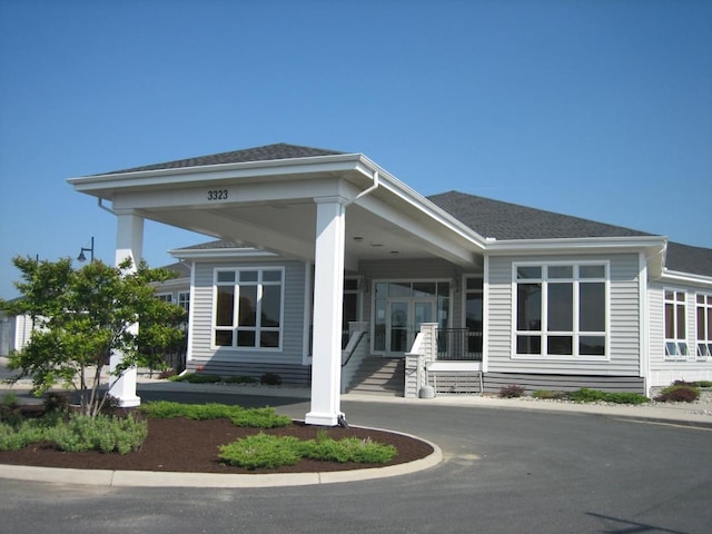 exterior space with a shingled roof