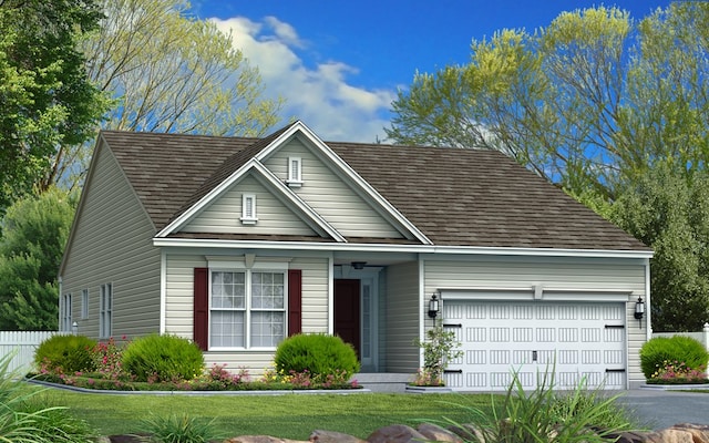 view of front of house featuring a garage and a front yard