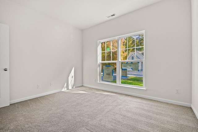 unfurnished room featuring carpet