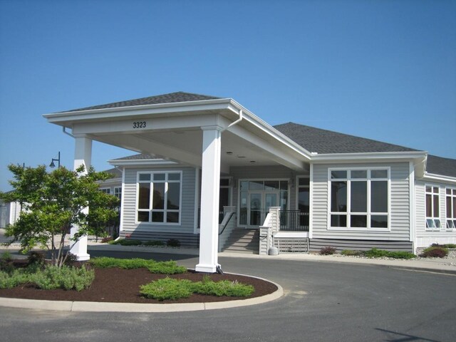 back of property featuring a porch