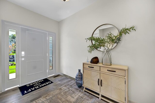 entryway with dark wood-type flooring