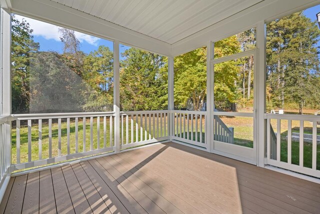 unfurnished sunroom featuring a healthy amount of sunlight