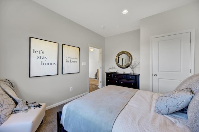 bedroom featuring dark colored carpet