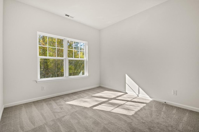 empty room with light colored carpet