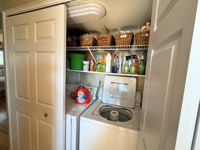 clothes washing area with laundry area and washing machine and clothes dryer