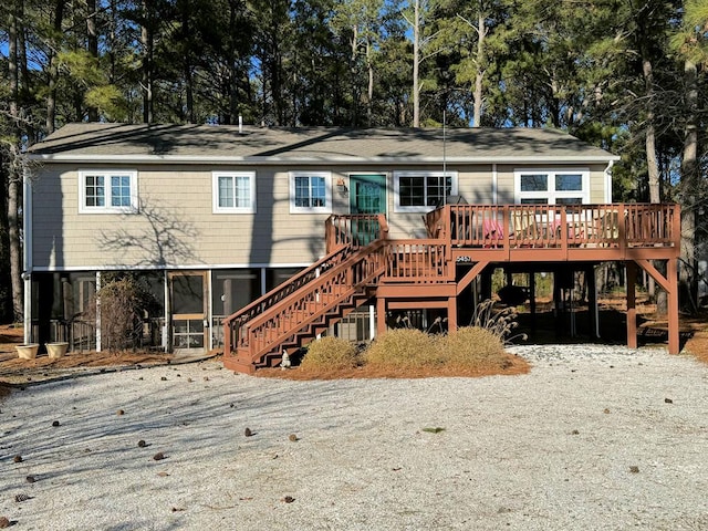 view of front of home featuring stairs and a wooden deck