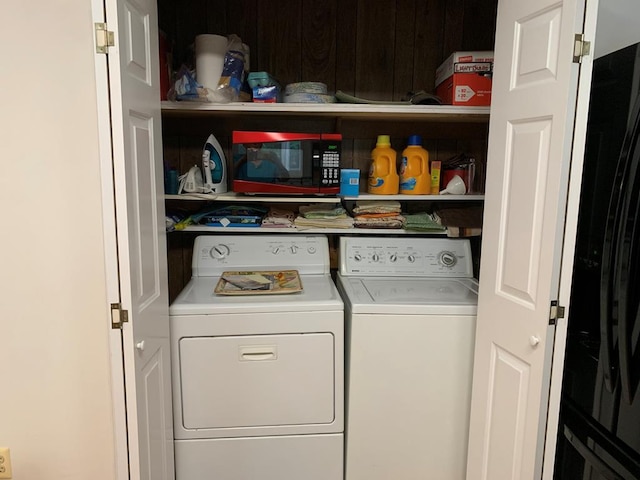 clothes washing area with independent washer and dryer