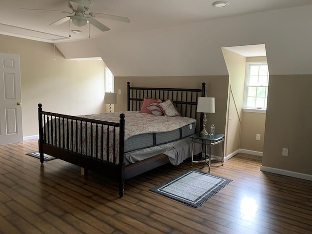 bedroom with ceiling fan, wood-type flooring, and vaulted ceiling