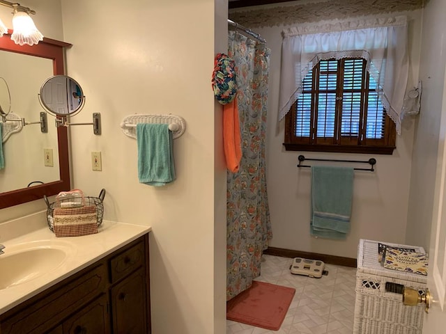 bathroom with a shower with curtain and vanity