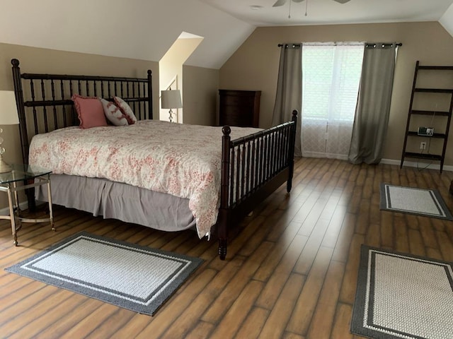 bedroom featuring vaulted ceiling, ceiling fan, and dark hardwood / wood-style floors