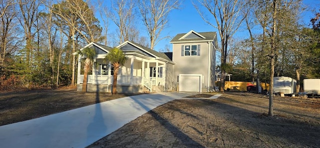 view of front of property featuring covered porch and a garage