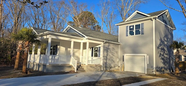 view of front of home with a porch and a garage