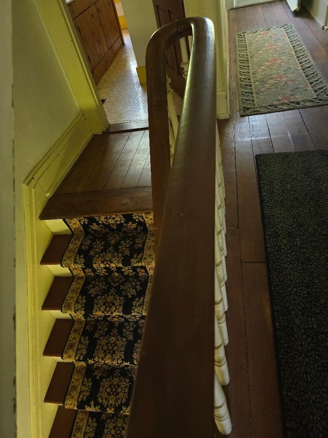 stairway featuring hardwood / wood-style floors