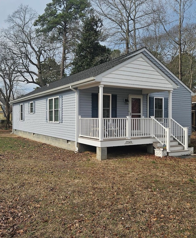 view of front of house featuring crawl space, a porch, and roof with shingles