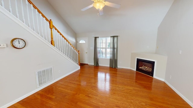 unfurnished living room with ceiling fan and wood-type flooring