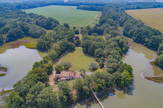 birds eye view of property featuring a water view and a rural view