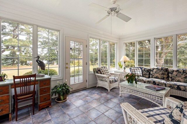 sunroom featuring ceiling fan