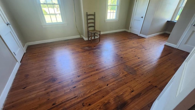 unfurnished bedroom featuring dark hardwood / wood-style floors