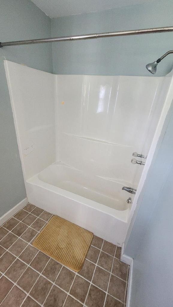 bathroom featuring shower / bath combination and tile patterned floors