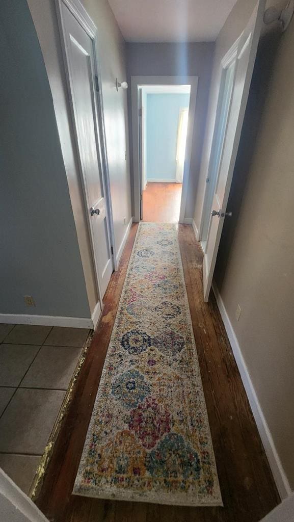 hallway featuring dark wood-type flooring