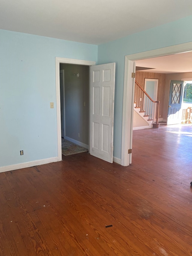 unfurnished room featuring dark hardwood / wood-style floors