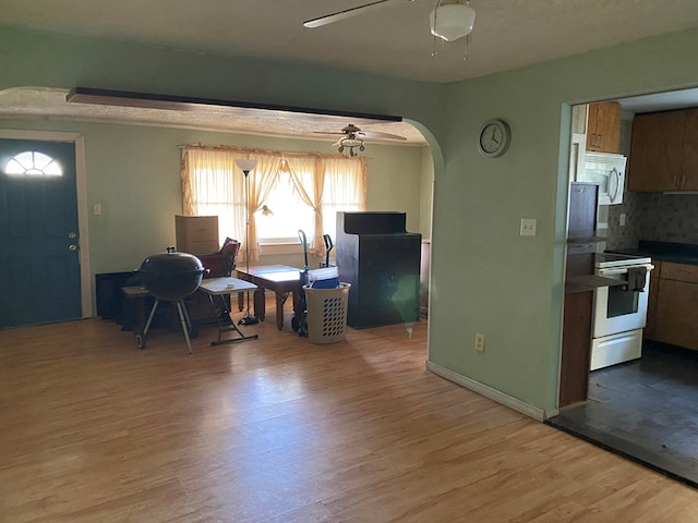 interior space featuring ceiling fan and hardwood / wood-style flooring