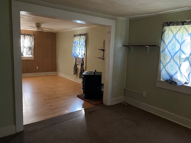 spare room featuring ceiling fan, plenty of natural light, and ornamental molding