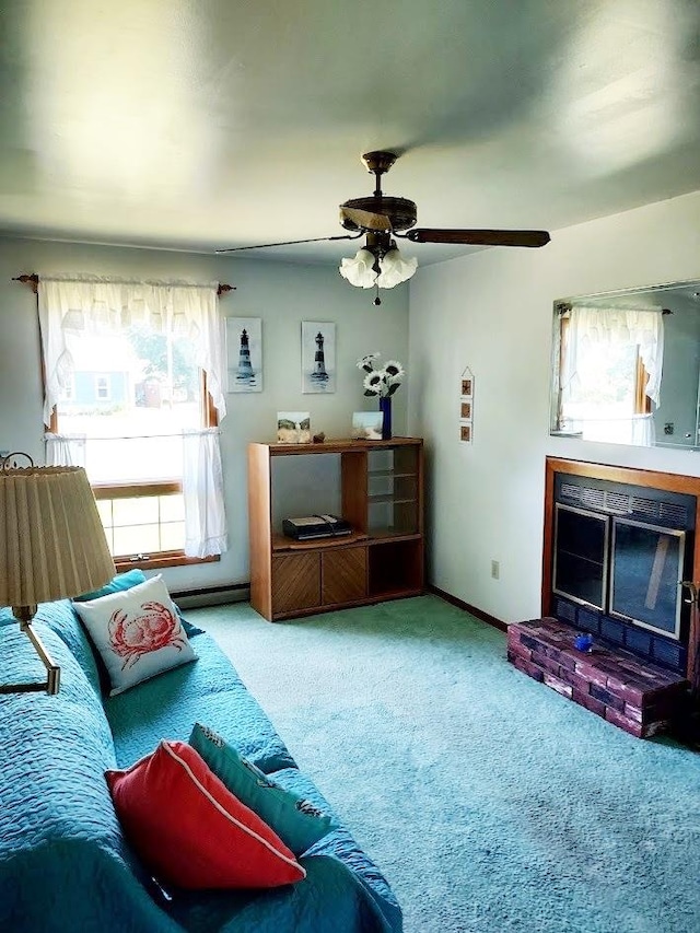 carpeted living room with ceiling fan and a brick fireplace