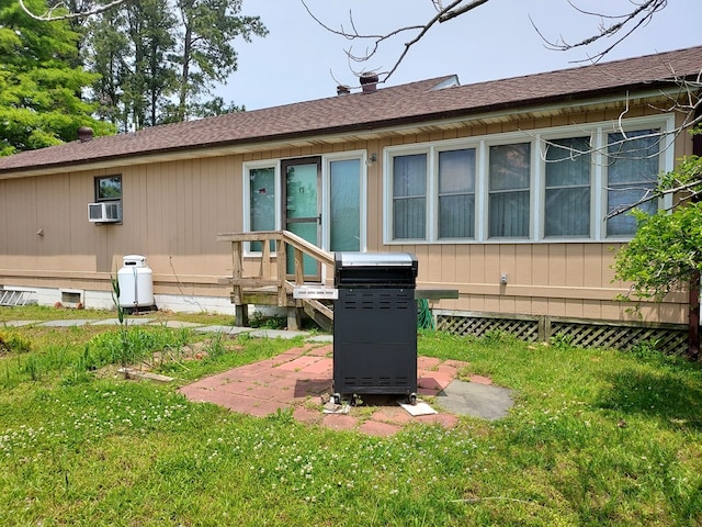 back of property featuring cooling unit