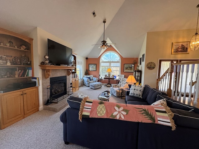 20444 Baldpate Ln, Onancock, VA 23417 - living area featuring light colored carpet, a fireplace, a ceiling fan, a chandelier, and high vaulted ceiling
