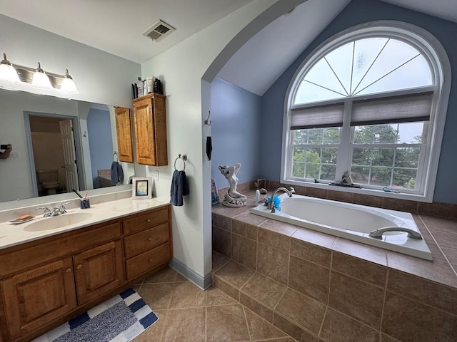 20444 Baldpate Ln, Onancock, VA 23417 - full bathroom with vanity, a bath, vaulted ceiling, and tile patterned floors