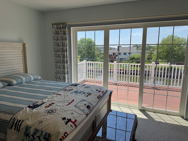 20444 Baldpate Ln, Onancock, VA 23417 - bedroom with access to exterior, a water view, multiple windows, and carpet flooring