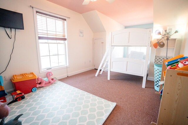 game room featuring lofted ceiling, baseboards, carpet floors, and ceiling fan