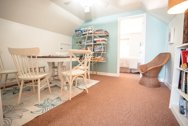 office space featuring ceiling fan, baseboards, carpet, and lofted ceiling