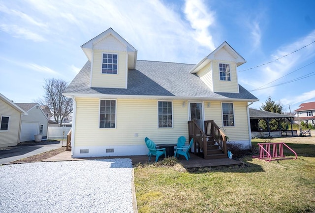 view of front of house featuring a front yard, roof with shingles, and crawl space