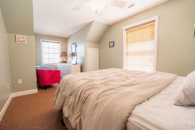 bedroom with visible vents, lofted ceiling, carpet flooring, baseboards, and ceiling fan