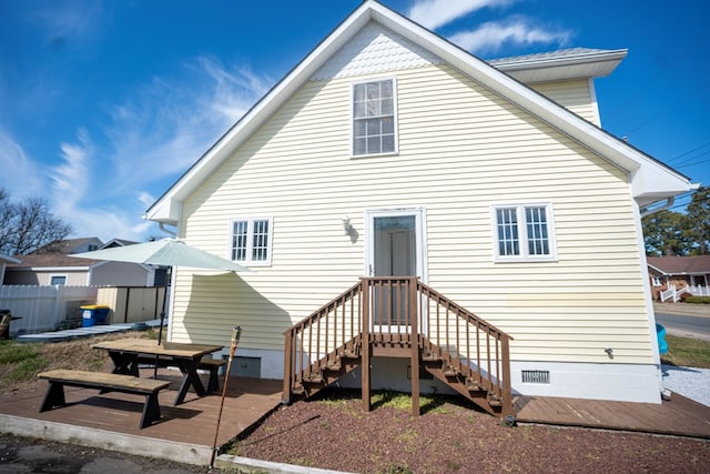 back of house with a patio, fence, and crawl space