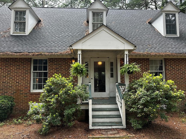 7086 Long Point Rd, Exmore, VA 23350 - property entrance with a shingled roof and brick siding